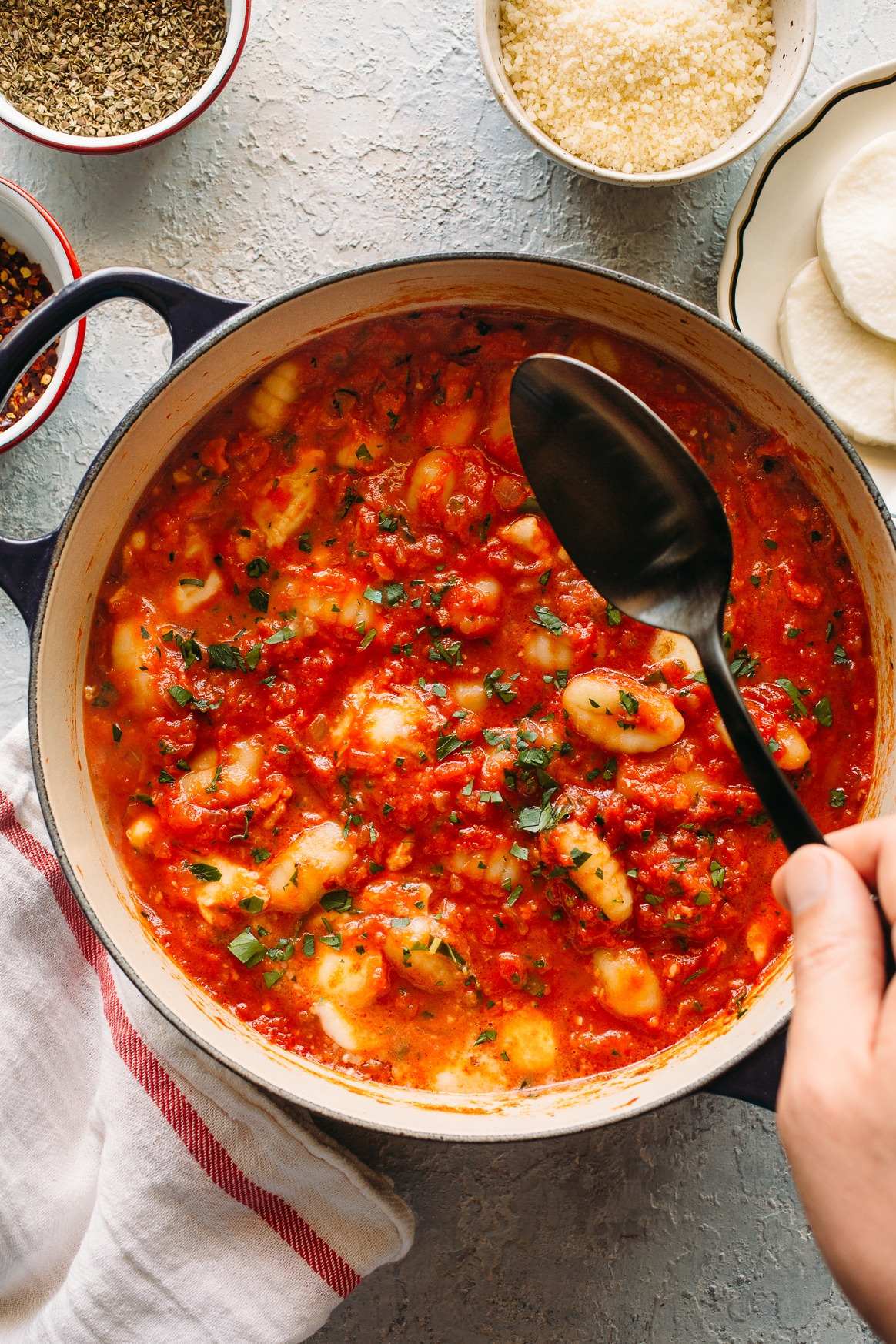 Spooning up Gnocchi with Tomato Sauce