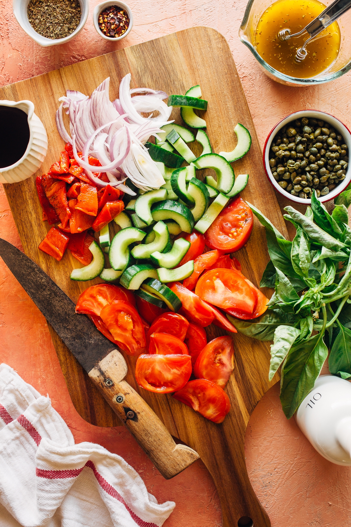 Chopping Tomatoes, Cucumbers, Red Onion and Roasted Red Peppers